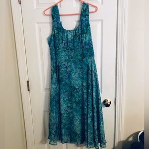 Dress sits just below the knees. With short crop jacket to match.